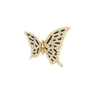 Gold butterfly pendant necklace featuring sparkling crystals and black enamel accents