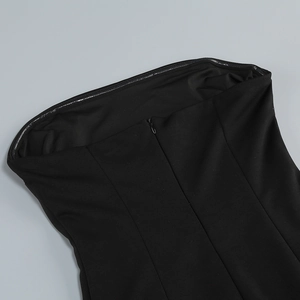 Detail of invisible back zipper and non-slip silicone strip on black tube dress