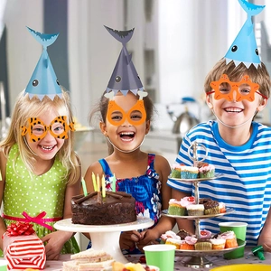 Kids shark themed birthday party glasses and hats set for fun ocean celebration