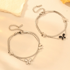 Detail of stainless steel double-layer butterfly bracelets with black and pearl shells