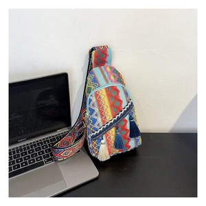 Ethnic woven crossbody chest bag with colorful bohemian patterns and tassel details