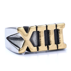 Detail of two-tone stainless steel ring featuring Roman numeral XIII engraving