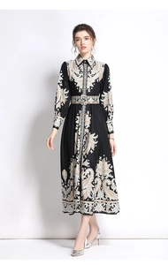 Front full view of black paisley maxi dress with long sleeves and matching waist belt