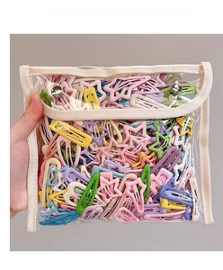 Detail of colorful star and rectangle macaron hair clips in a high-quality metal finish