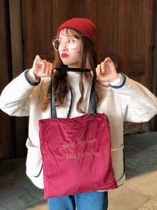 Vintage burgundy velvet shoulder bag with gold 'love rewards the brave' embroidery