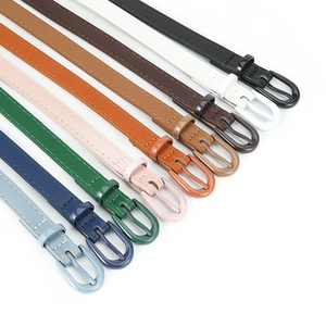 Fashionable PU leather skinny belts for women in multiple colors with matching metal buckles