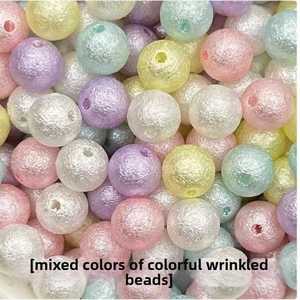 Macro shot of colorful wrinkled ABS pearl beads in pastel tones for DIY jewelry making