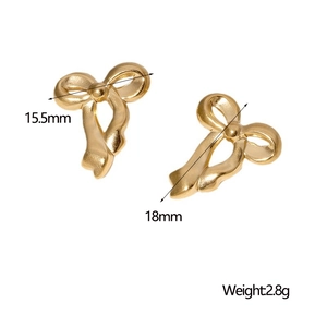 Detail view of gold bow earrings showing dimensions 15.5mm by 18mm and 2.8g weight