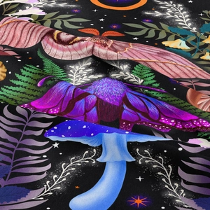 Macro shot of moon phase tapestry showing pink moths and glowing blue mushrooms on fabric