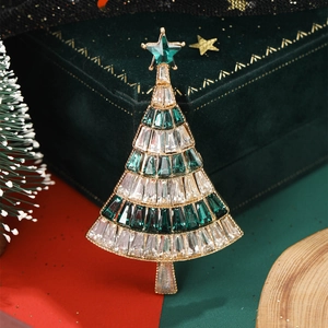 Sparkling Christmas tree brooch with green crystals on velvet gift box setup