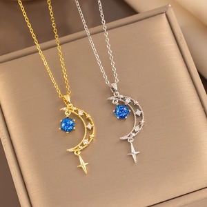 Elegant gold and silver necklaces featuring blue zircon moon and star pendant charms