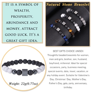 Detail view of 8mm natural tiger eye and volcanic stone bracelets weighing 22g each