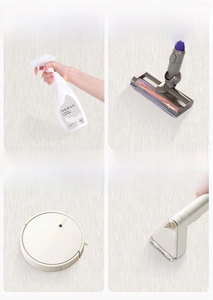 Close-up of cream textured rug fiber being cleaned with a vacuum cleaner and mop