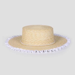 Close-up of woven straw boater hat with white lace trim and elegant pearl band detail