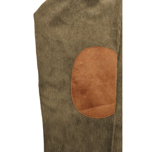 Detail of olive green knit fabric with vertical texture and brown elbow patch on polo shirt