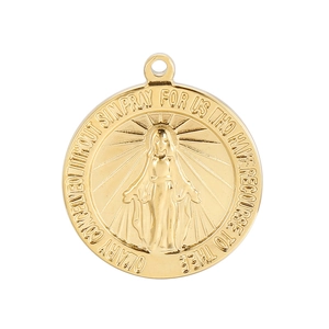 Detailed macro view of gold Virgin Mary pendant with engraved religious text on white background