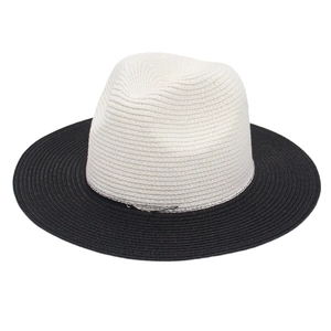 Detail of two-tone panama straw hat with cream woven crown and black brim contrast