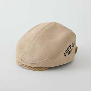 Detail of beige faux suede hat showing BOSTON 1920 embroidery and corduroy brim