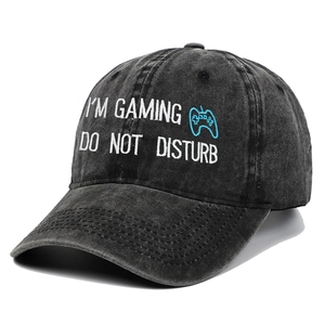 Washed black cotton baseball cap with embroidered gaming text and controller icon