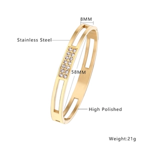 Detailed view of gold stainless steel bangle with diamond inlay and 58mm inner diameter