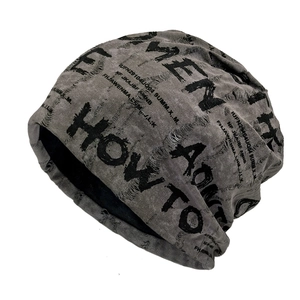 Distressed grey knit beanie with black letter print and vintage street style finish