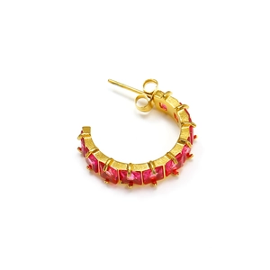 Detailed close-up of C-shaped gold-plated earrings with square red zircon stones