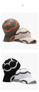Detailed view of four distressed cotton baseball caps with circular geometric patterns