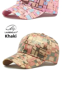 Detail of khaki and pink sequin baseball caps with sparkling checkered pattern texture