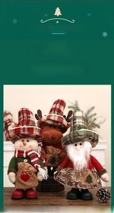 Three plush Christmas figurines with plaid hats and burlap bags on a wooden surface