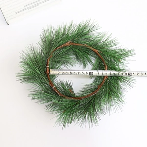 Green PVC pine needle Christmas wreath with 20cm diameter measurement on white background