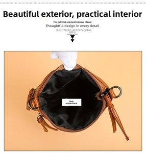 Top view of brown leather crossbody phone bag interior with black fabric lining
