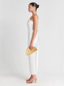 Elegant white side slit maxi dress with long tassels and gold pleated fan clutch bag