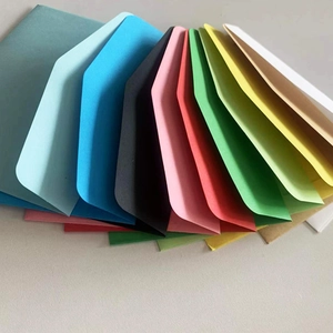 Selection of colorful kraft paper envelopes with heart closures in a variety of vibrant tones