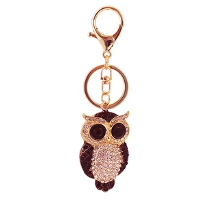Creative golden owl keychain for women's bags with white rhinestones and black accents