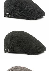 Detail view of herringbone texture and adjustable metal side buckles on retro ivy caps