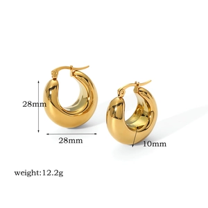 Detail view of gold crescent hoop earrings with size 28mm and weight 12.2g specifications