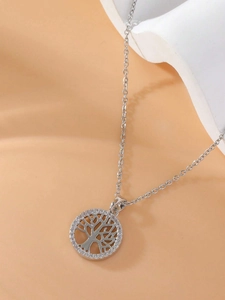 Close-up of tree of life pendant necklace featuring shimmering cubic zirconia stones