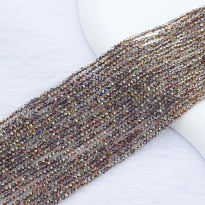Detailed macro shot of 2mm faceted crystal beads with Aurora plating for jewelry making