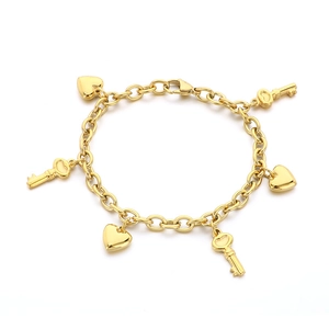 Golden stainless steel chain bracelet featuring alternating heart and key charms