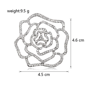 Elegant silver rose brooch with rhinestones, 4.5cm width and 9.5g weight on white background