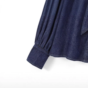 Women's dark blue denim shirt with bow-tie sleeves and detailed pleated craftsmanship