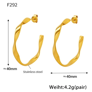 Detailed view of 40mm twisted C-shape gold earrings in stainless steel for women