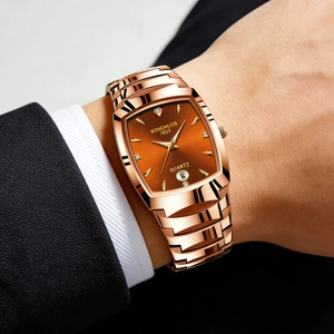 Detail of rose gold quartz watch on suit wrist showing brown dial and date window