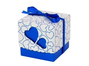 Detail of blue and white hollow heart candy box with elegant ribbon bow for weddings