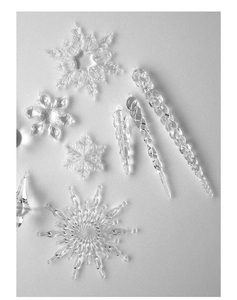 Macro shot of clear acrylic snowflakes and icicles for Christmas tree decorations