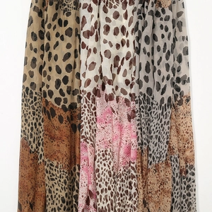 Detail of leopard print patchwork on lightweight translucent chiffon scarf fabric