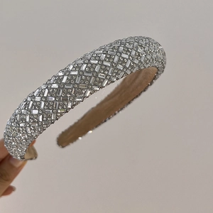 Close-up of sparkling silver rhinestones on a thick padded headband for women