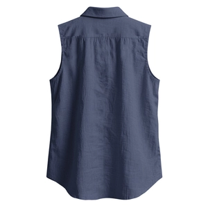 Detail of blue cotton-linen sleeveless shirt back with horizontal seam and curved hem