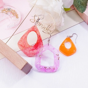 DIY geometric resin earrings mold kit showing star, moon and heart drop earrings with gold foil