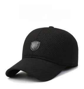 Detail of a men's winter baseball cap showing thick textured fabric and a shield logo